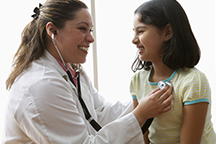 Female doctor with girl patient